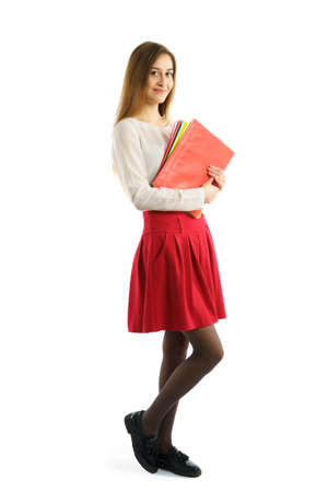 Portrait of cute young student girl with foldersの写真素材
