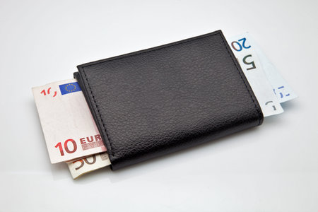 Black leather wallet with cash made