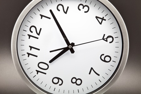 clock with white background and black needlesの写真素材