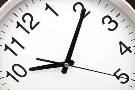 Clock with white background and black needlesの写真素材