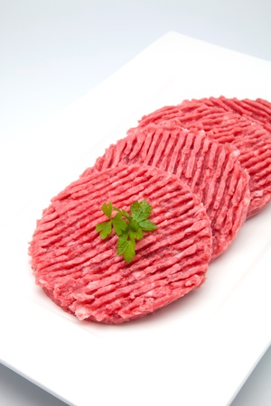 hamburger of raw meat ready to cook の写真素材