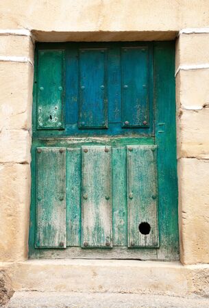 Ancient door of a cottageの写真素材