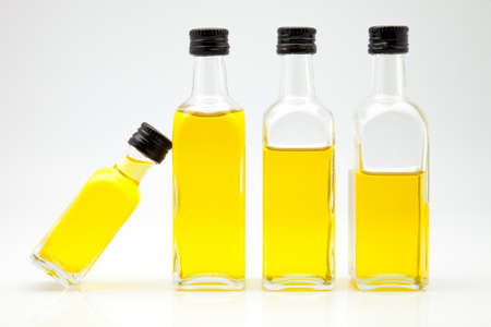 olive oil bottles on white fundの写真素材