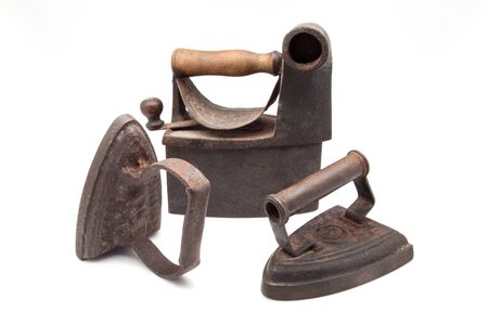 Old coal heated iron on whiteの写真素材