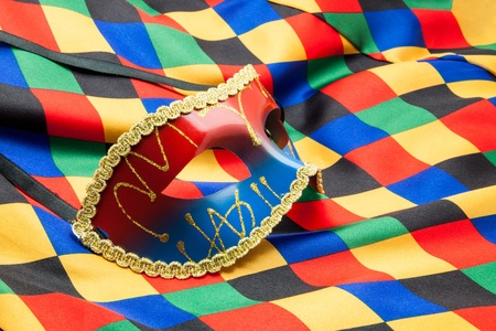 carnival mask on rhombs clothの写真素材