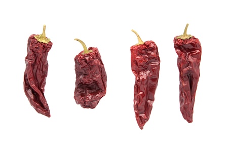 four dry and piquant peppersの写真素材