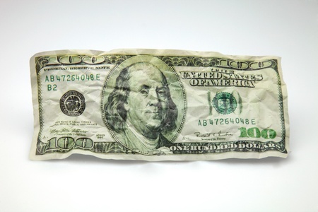 wrinkled and battered ticket for hundred dollarsの写真素材