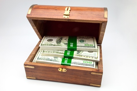 wooden chest with tickets of dollarの写真素材