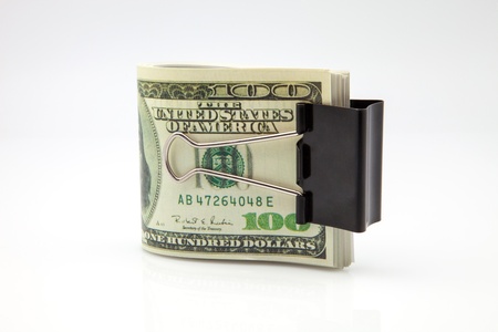 lot of hundred dollars subjects with a clampの写真素材