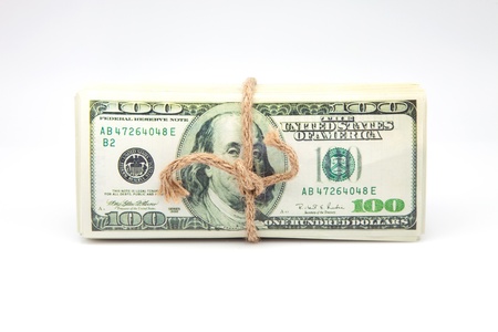 hundred dollar bills tied with a ropeの写真素材