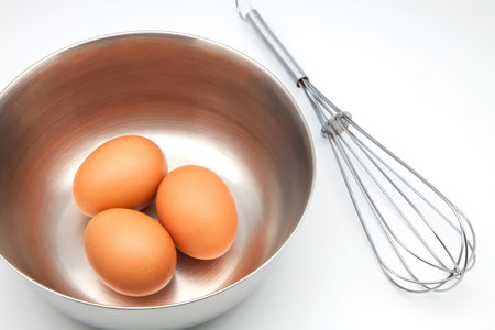 eggs in a bowl with a whisk