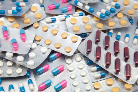 Close up of packs of pills and capsules.