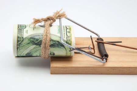mousetrap with a bundle of tickets for hundred dollars