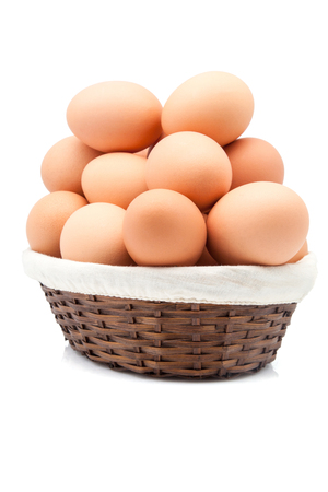 Bamboo basket full of brown eggsの写真素材