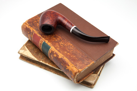 tobacco pipe on ancient booksの写真素材