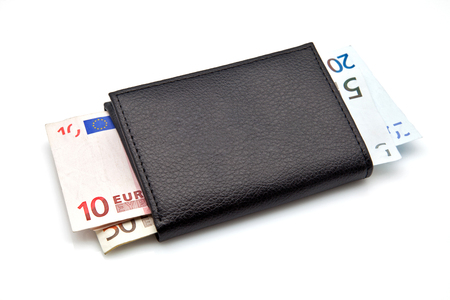 leather wallet filled with banknotesの写真素材
