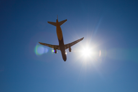 aircraft flying in a blue skyの写真素材