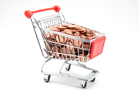 shopping cart full of coinsの写真素材