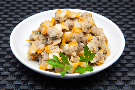 plate of cockles in vinegar and parsleyの写真素材