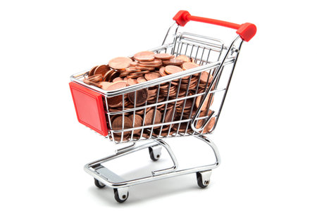 shopping cart with coins on a white backgroundの写真素材