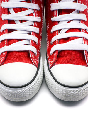 Red sneakers on white backgroundの写真素材