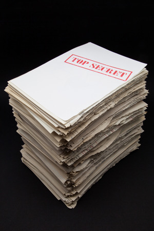 stack of secret documents on a black backgroundの写真素材