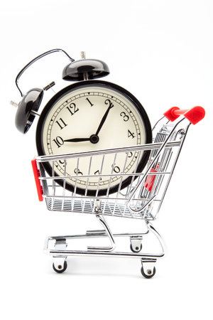 alarm clock in a shopping cartの写真素材
