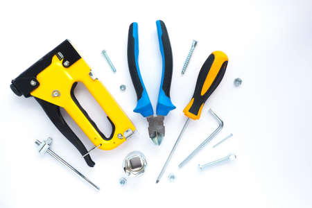 fasteners and repair tools on a white background. flat layout, top view. Space for text.の写真素材
