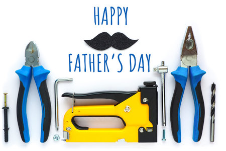 postcard of happy father's day. inscription in blue letters, black shiny mustache and tools for...