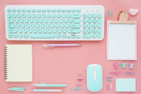 various office and business supplies laid out neatly on a pink background. Space for text. Flat layout, top view.の写真素材