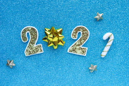 new year card on blue glittering background number 2021 and stars.の写真素材
