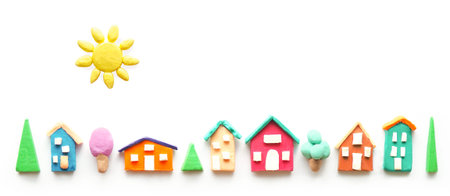 banner multi-colored cute houses made of plasticine.copy space.