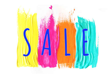 the inscription SALE on bright multi-colored strokes of paint.の写真素材