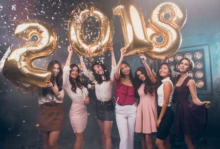Happy 2018 Year! Hand's up! Fun is all we need!  Beautiful group of smiling girls carrying gold...
