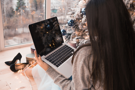 Portrait of a beautiful working girl on the eve of Christmas. winter holidays and people concept. Happy New Year to you!の写真素材