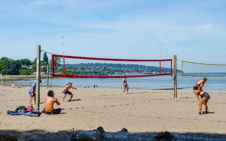 Kitsilano Beach~Vancouver BC, Canada. June 2 2019 People enjoying the weather playing volleyball at Kitsilano Beach in Vancouver British Columbia, Canadaのeditorial素材