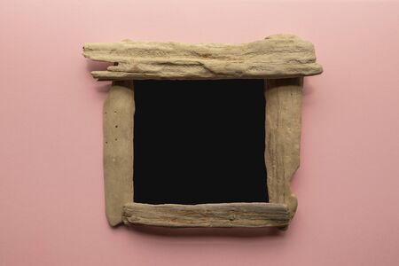 Driftwood chalkboard sign to add your own text - blackboard mockup on pink backgroundの写真素材