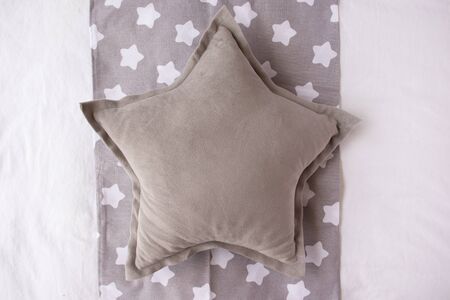 Gray star cushion mock up on a grey and white background with stars - blank pillow for own designの写真素材