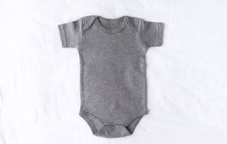 Gray baby bodysuit mock up with on a white cotton background - blank for own designの写真素材