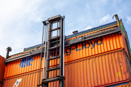 Istanbul, Beylikduzu - Turkey - 07.07.2023 Container yard for Logistic Import Export business, colorful container stack. view from moment of load. crane hold a containerのeditorial素材