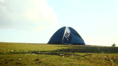 Blue tent on green grass. great environment.の写真素材
