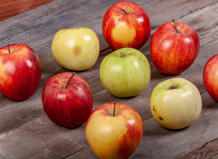 A lot of apples on a wooden table