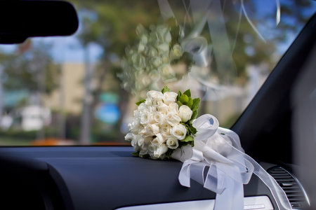 white wedding bouquet inside the carの写真素材