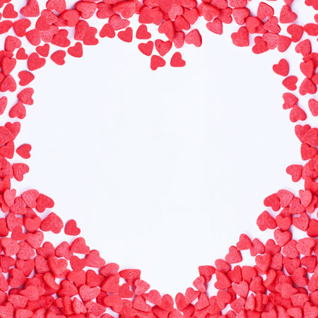 heart Frame made of small red hearts on the white backgroundの写真素材