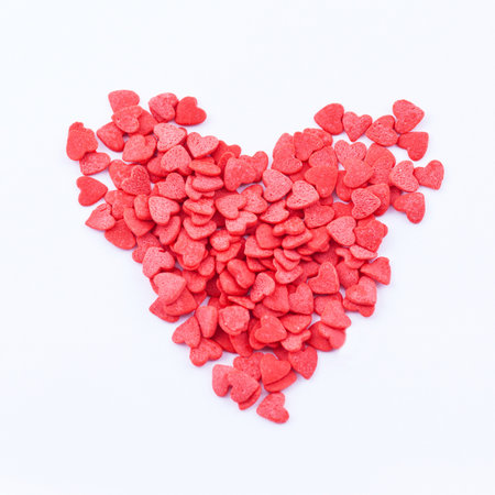 Heart shape consists of small read hearts on the white backgroundの写真素材