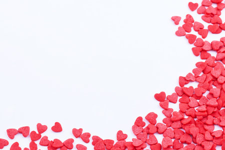 Frame made of small red hearts on the white backgroundの写真素材