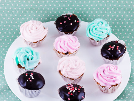 sweet cupcakes with hearts on blue backgroundの写真素材