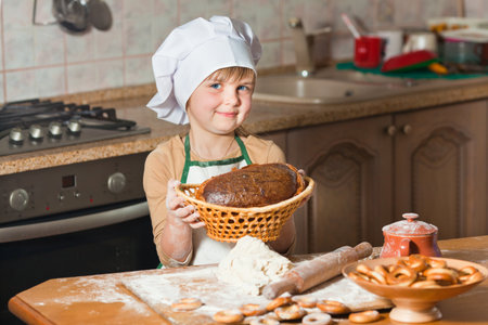 Cute girl baking cookiesの写真素材