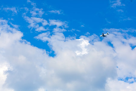airplane in the clouds,  Passenger Airlinerの写真素材