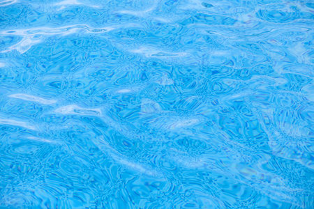 Clean water in blue swimming pool の写真素材